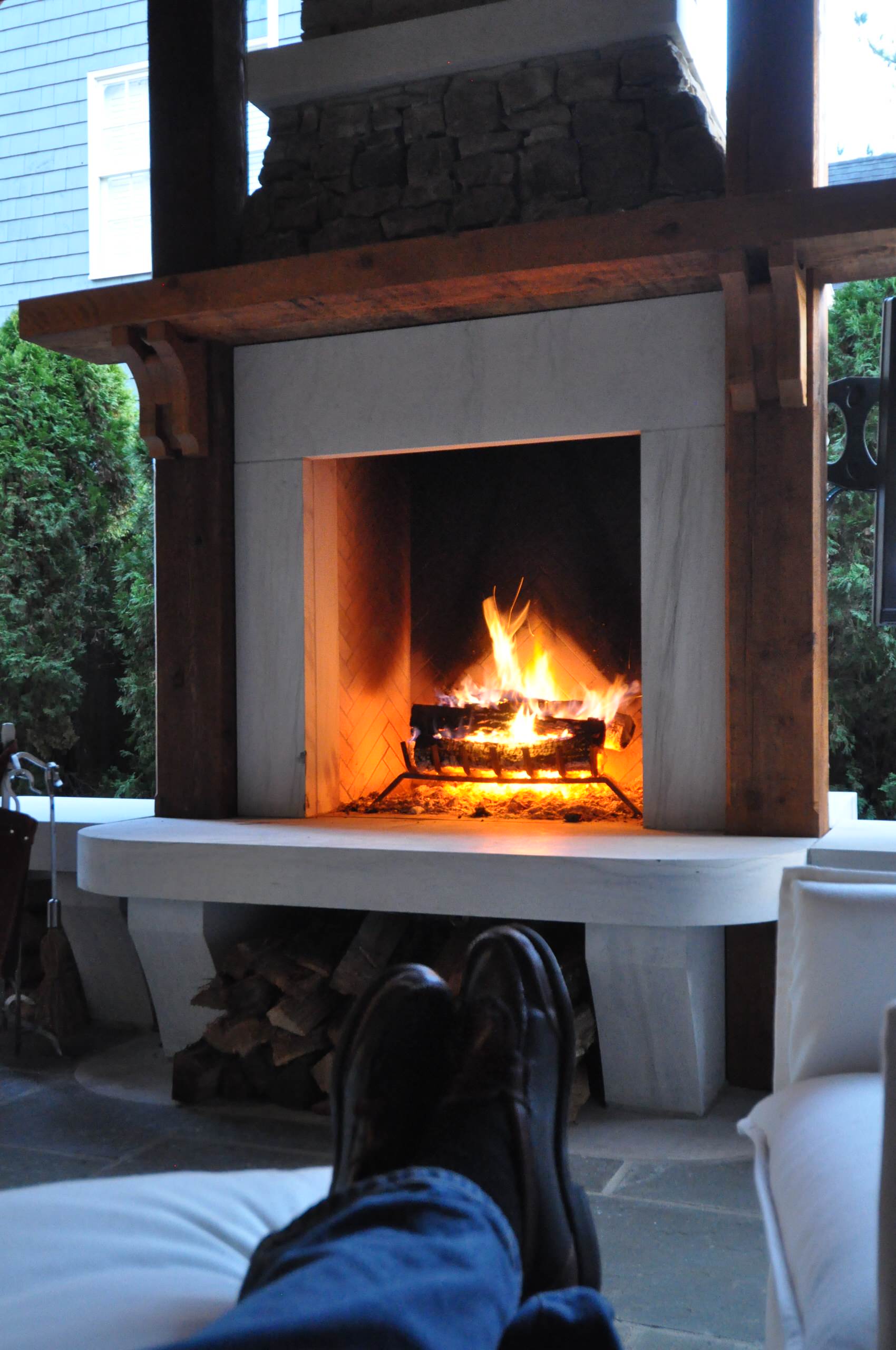 roaring outdoor fireplace from a newly built custom home